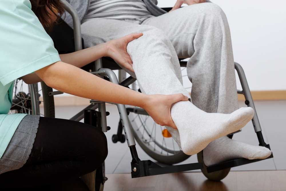 a person receiving physical therapy for their leg