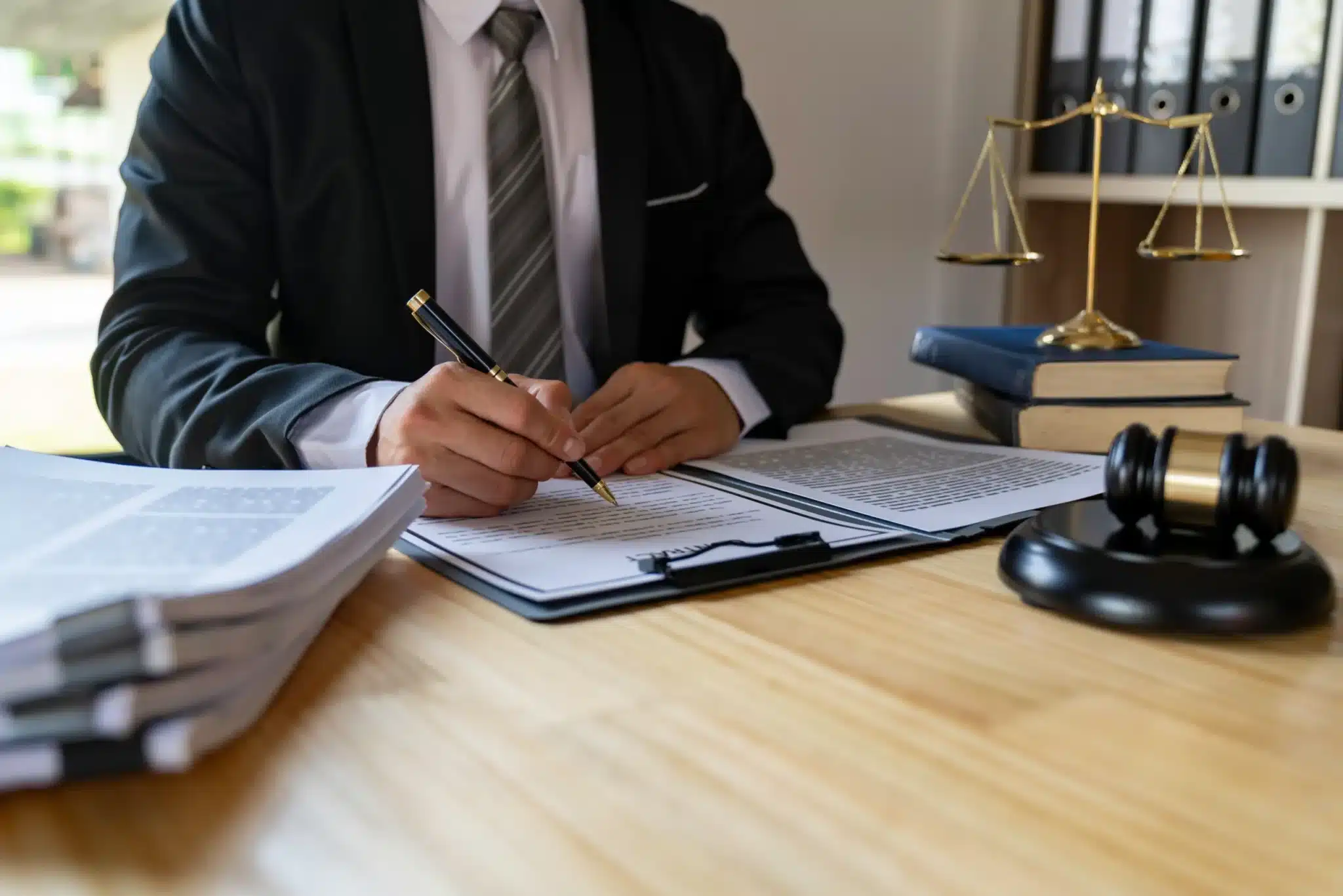 Attorney signing a document