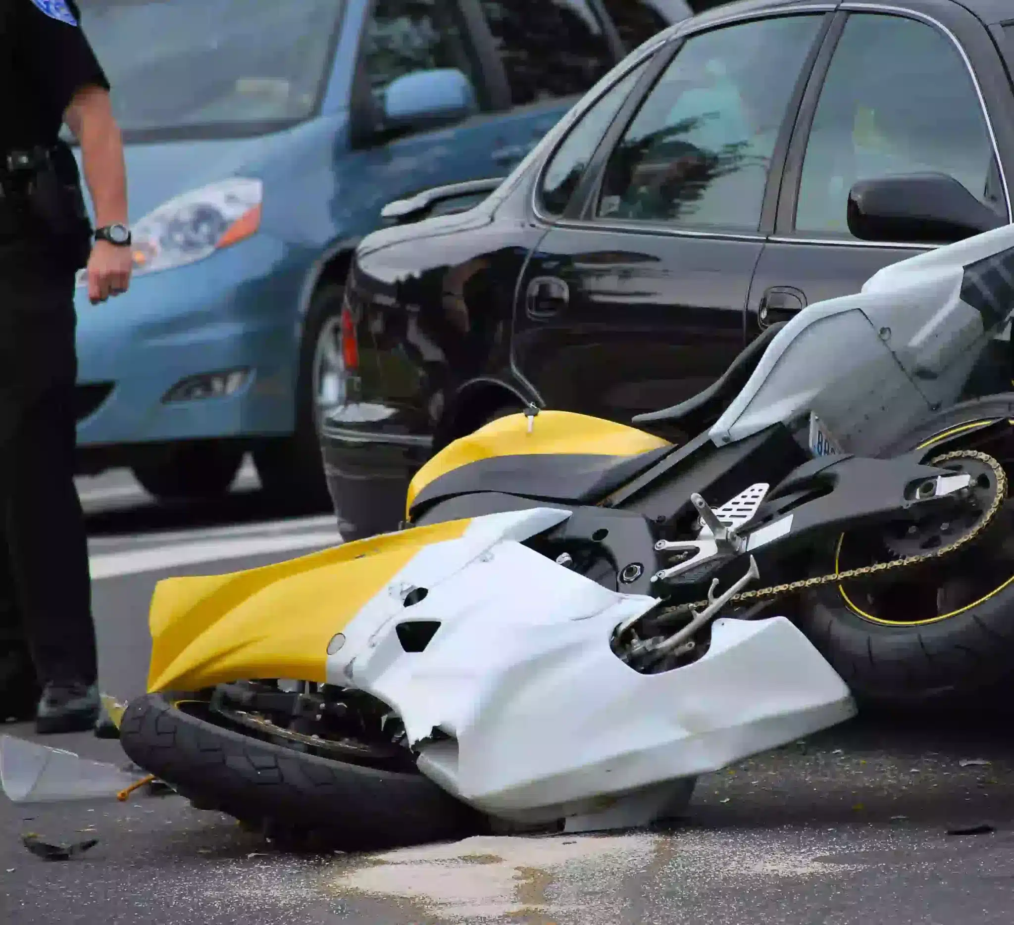 Yellow motorbike broken after an accident on the highway